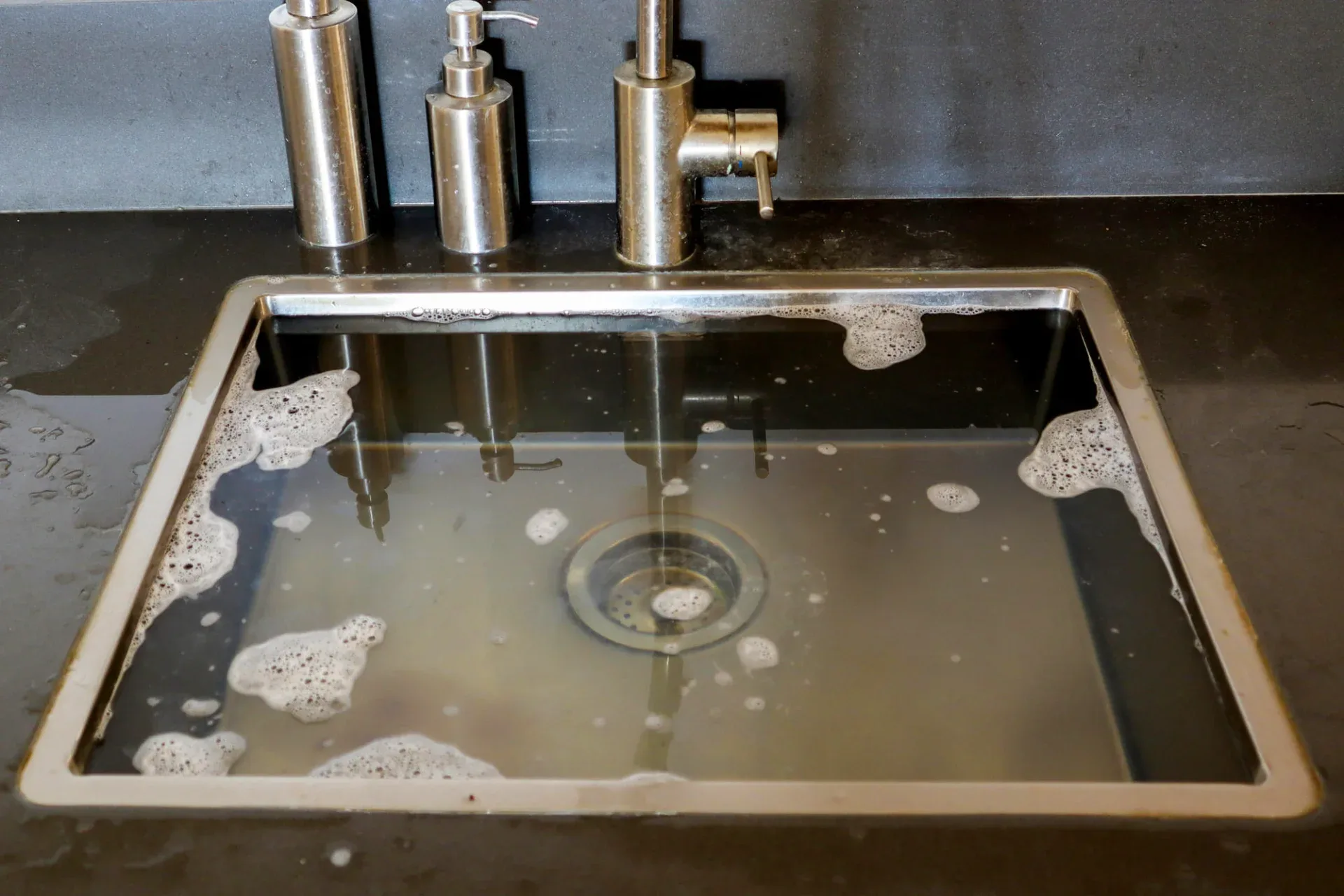 Grease and hair buildup in drain pipes
